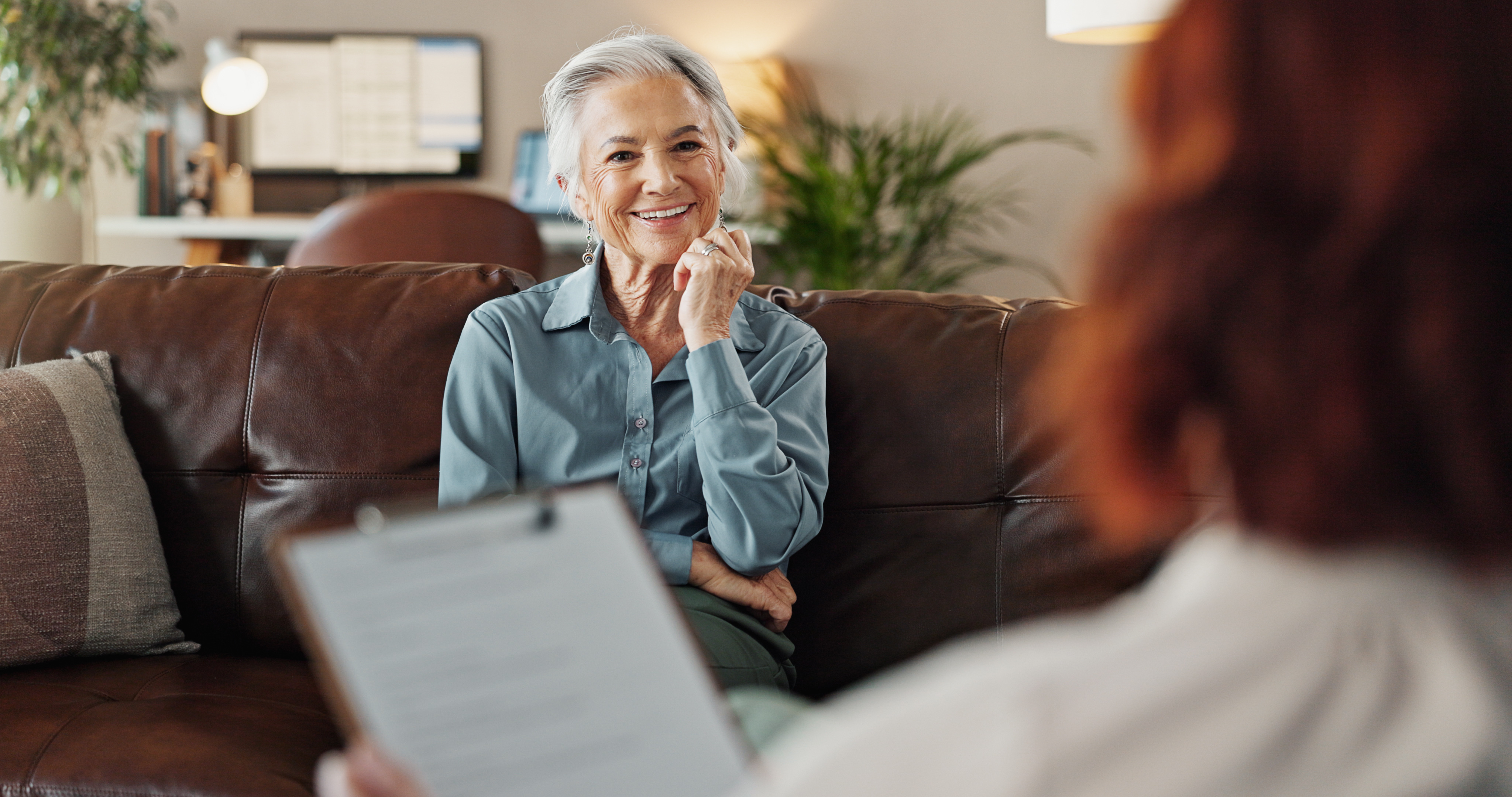 Counselor smiling warmly during a therapy consultation
