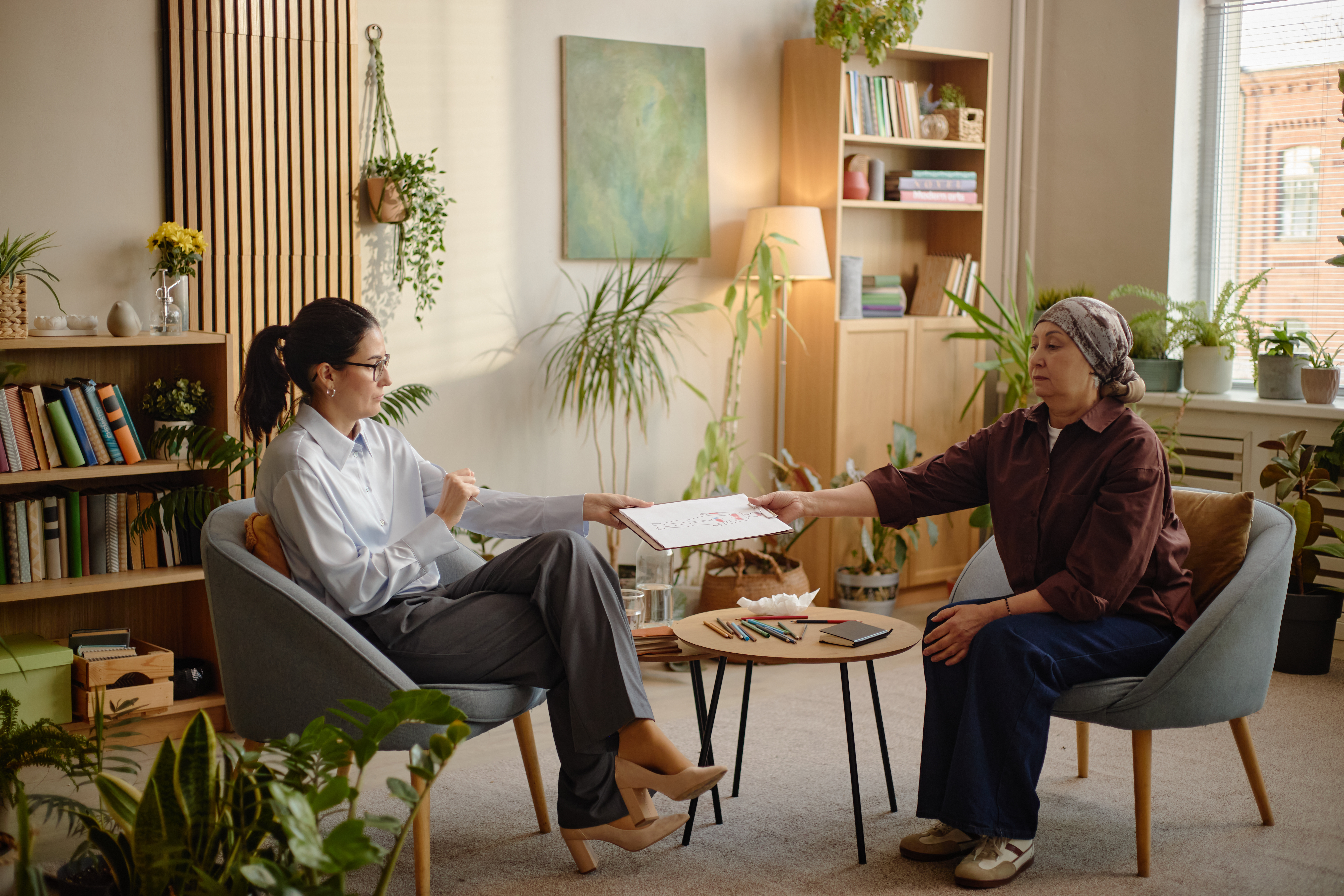 Therapist and client in a warm, welcoming office setting